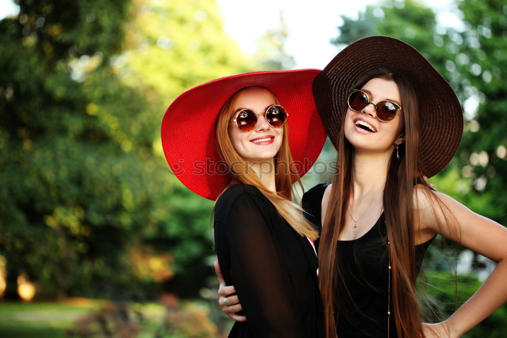 Two girls sitting on the bench and smile