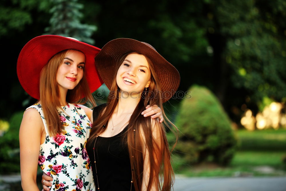 Similar – Two girls sitting on the bench and smile