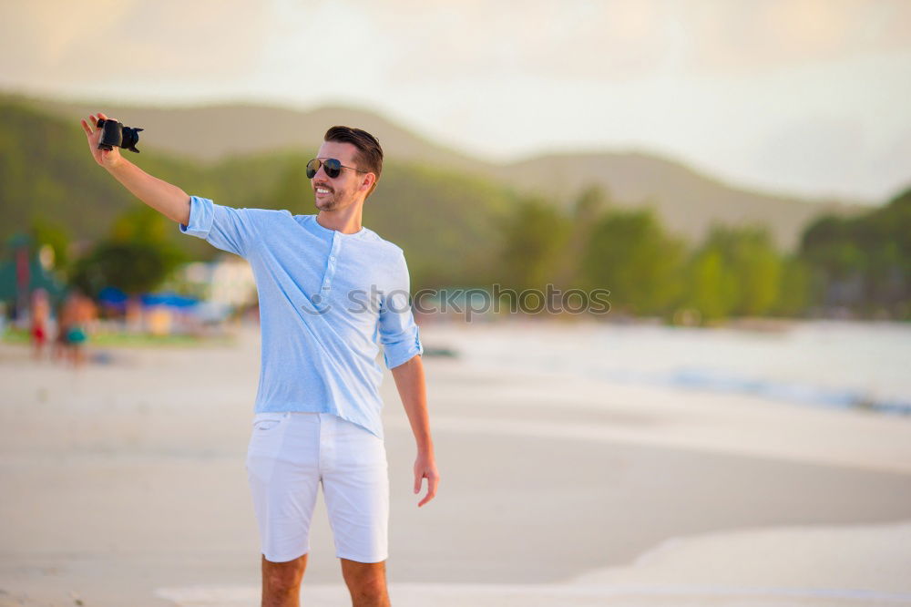 Similar – Man with skateboard at beach