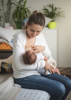 Similar – Mother breastfeed baby while playing with smartphone