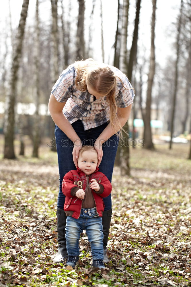 Grandma has her grandson on her arm