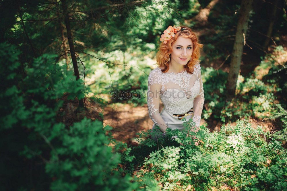 A Young Woman Standing in the Woods