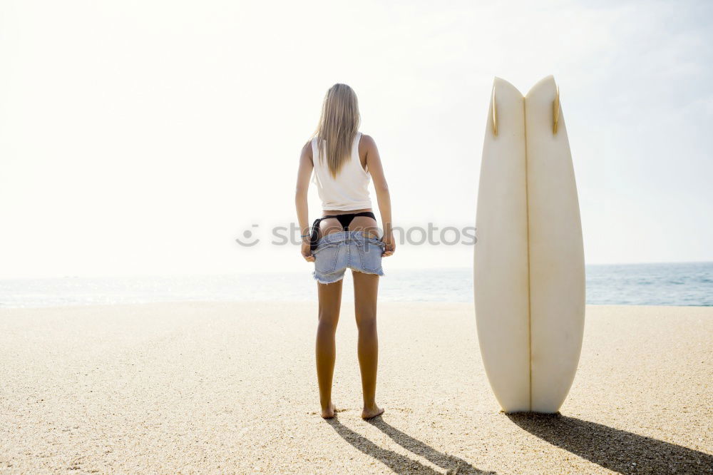 Similar – Group of girls holding surfboard on beach