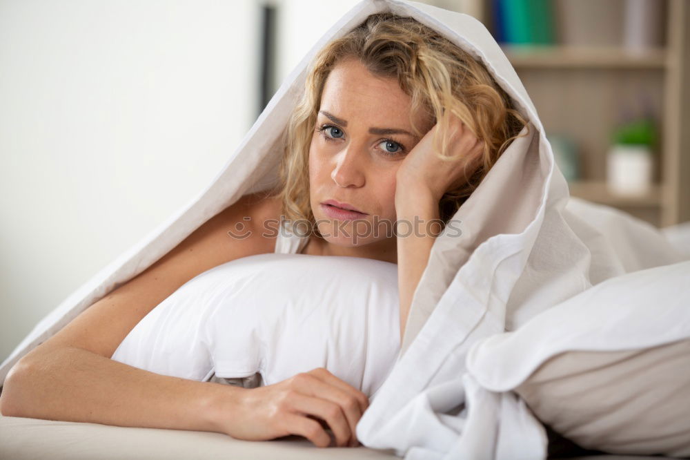 Similar – Young woman lying in bed