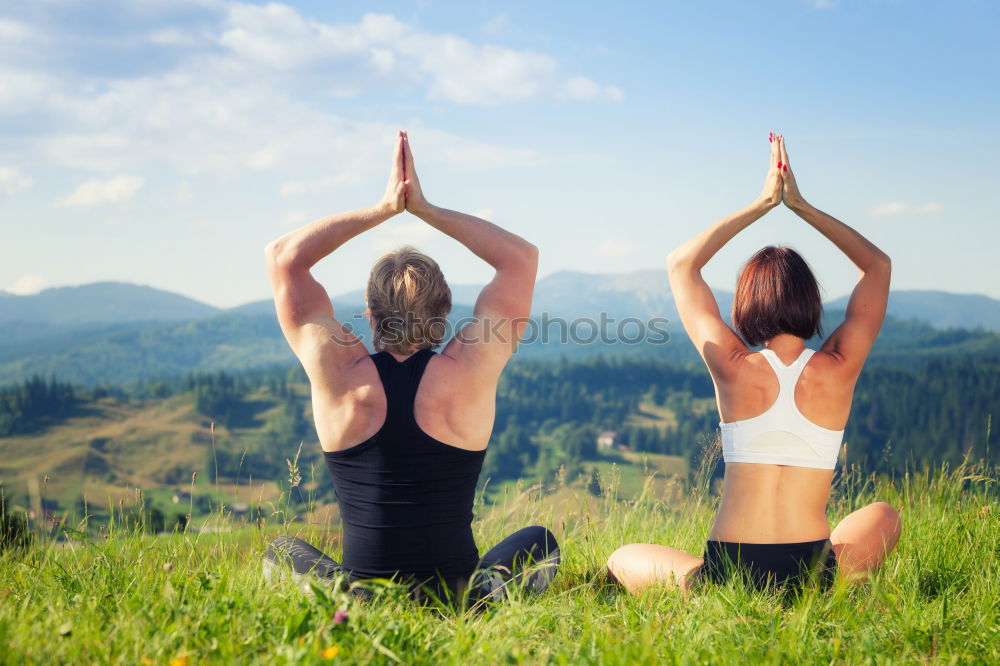 Similar – Image, Stock Photo Mother and daughter doing yoga exercises on the beach.