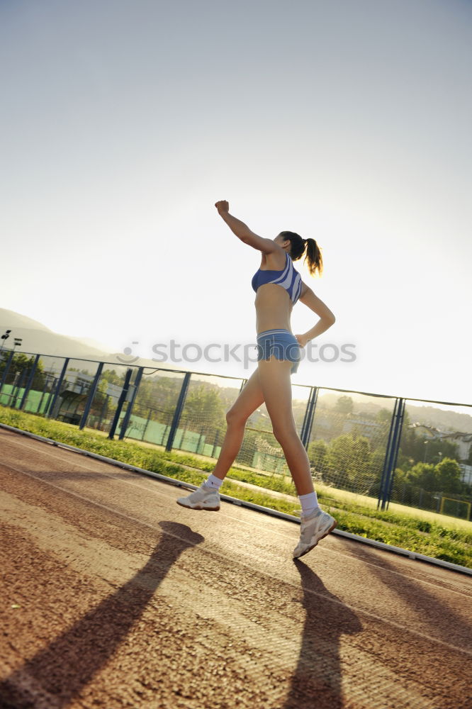 Similar – Female young athlete doing interval training on stairs