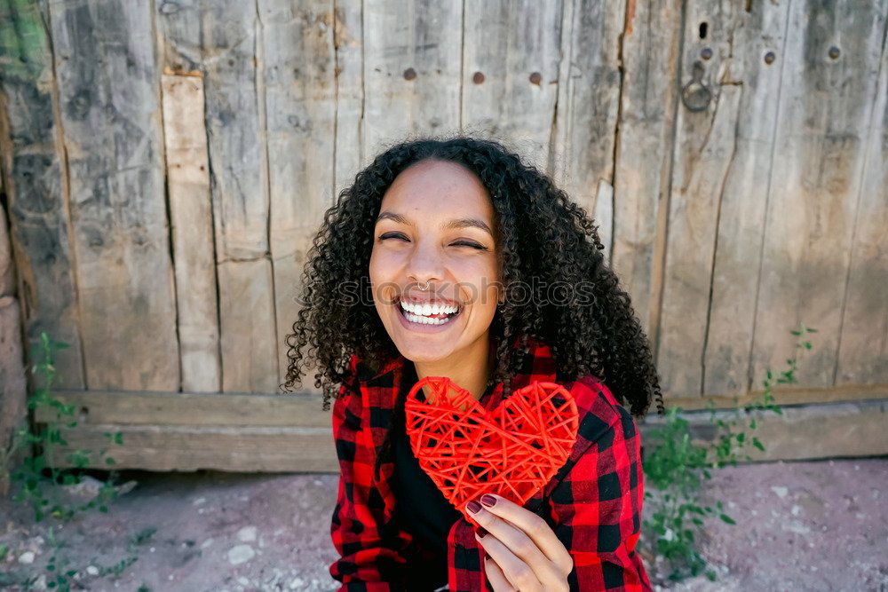 Similar – Image, Stock Photo Beautiful young woman holding a red heart