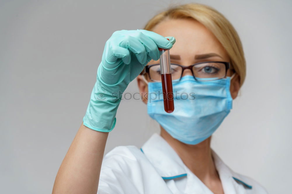 Similar – Image, Stock Photo Female doctor putting on her protective gloves