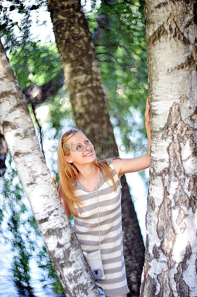 Similar – Image, Stock Photo Young woman sitting smiling on a bench in a forest