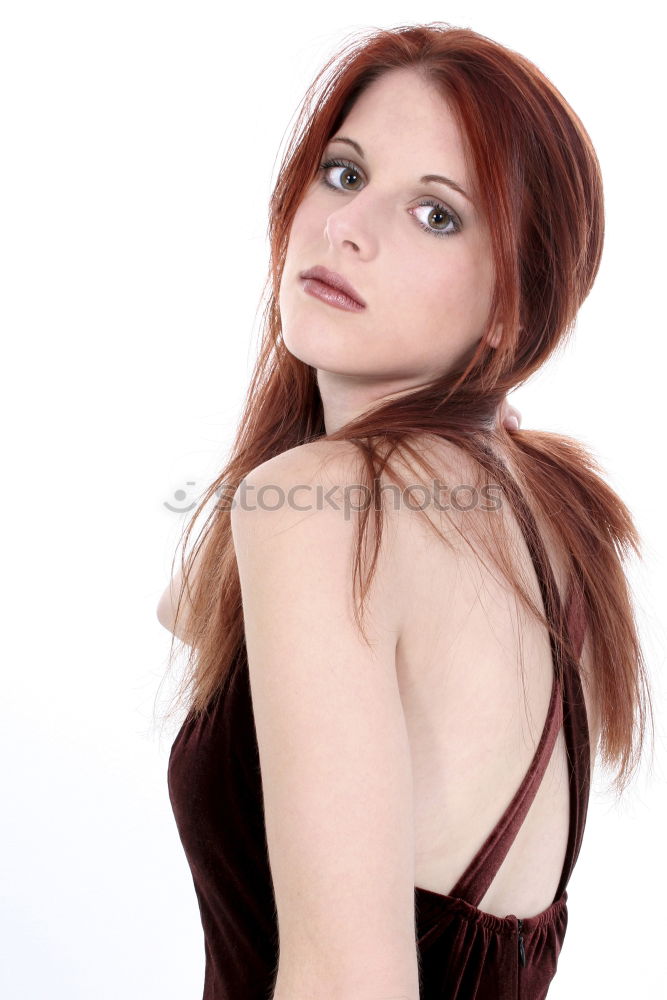 Similar – Young woman in undershirt sitting on a flowered couch and looking sideways into the camera