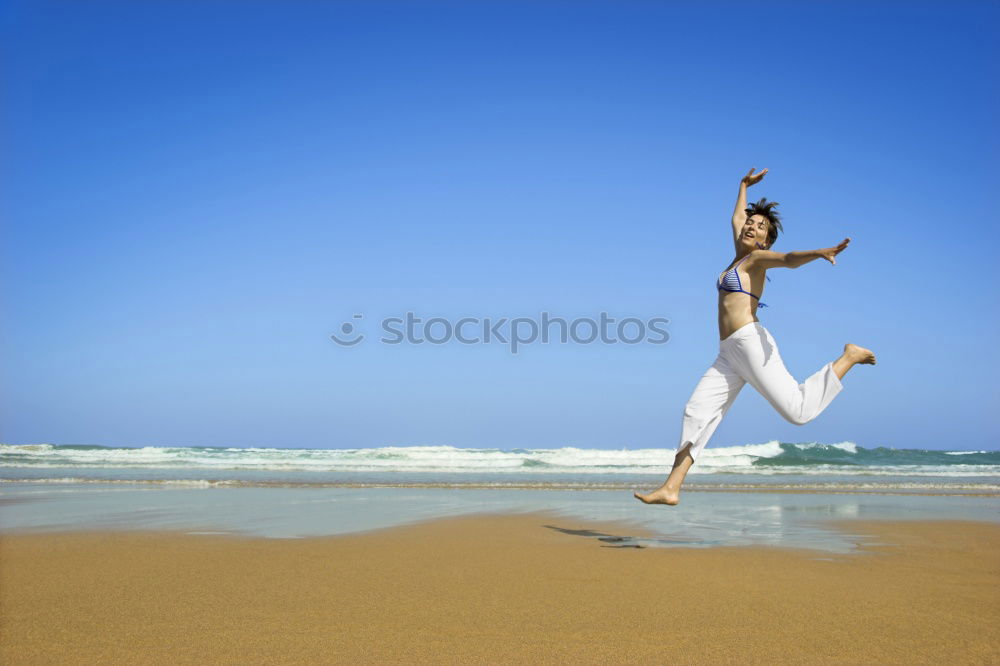 Similar – Image, Stock Photo playing on the beach