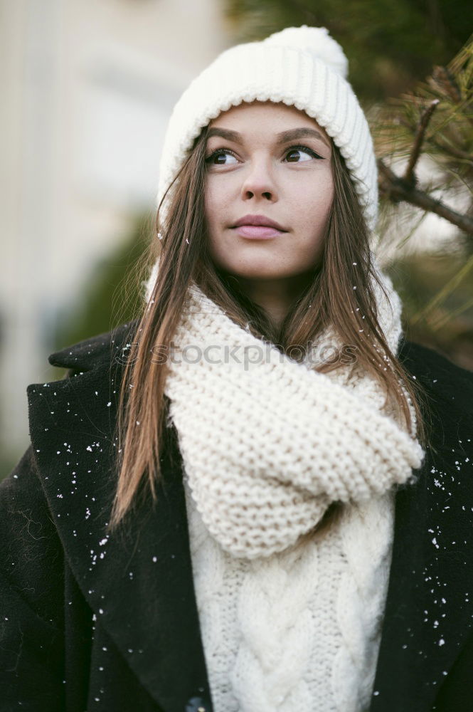 Similar – Young woman sitting on the street