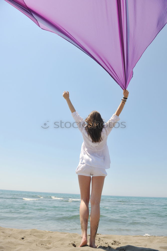 Similar – Image, Stock Photo Woman holding the Gay Rainbow Flag over blue sky outdoors