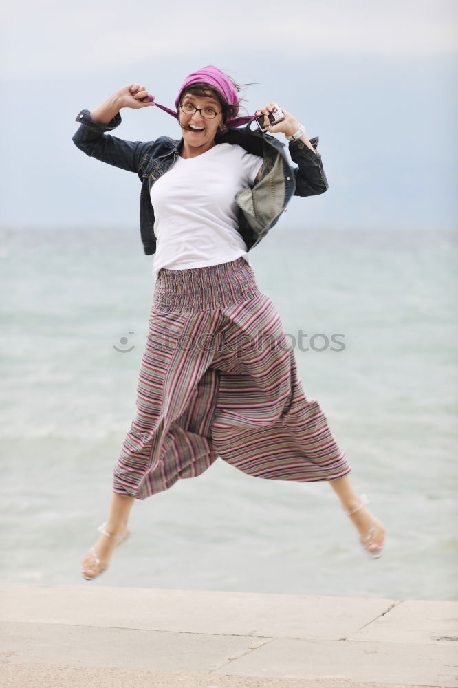 Similar – Image, Stock Photo Happy young woman laughing on steps in the street.