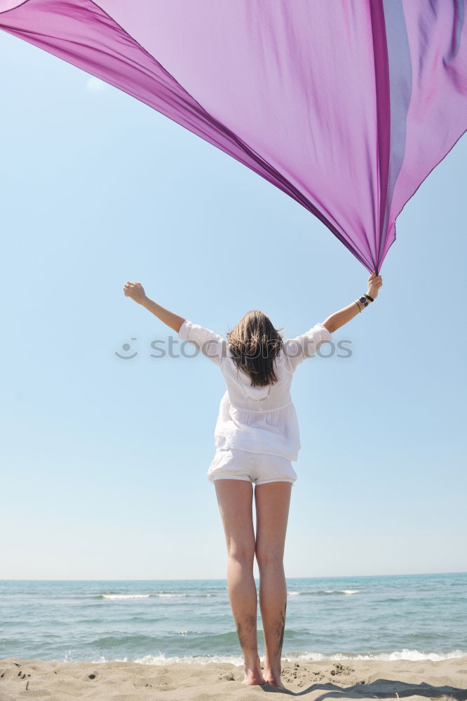 Similar – Image, Stock Photo Woman holding the Gay Rainbow Flag over blue sky outdoors