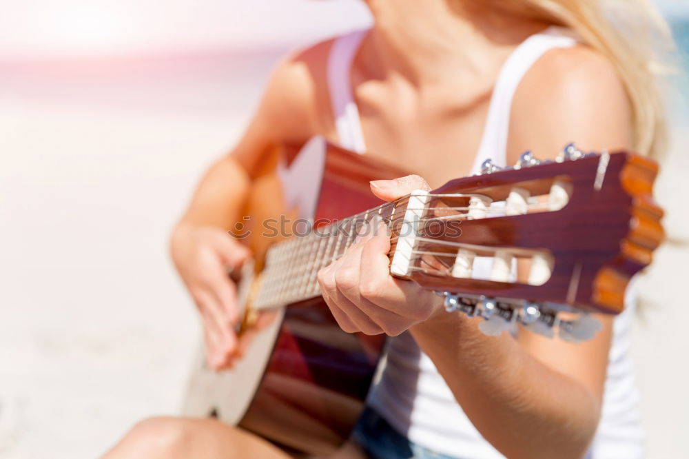 Similar – Beautiful woman playing guitar.