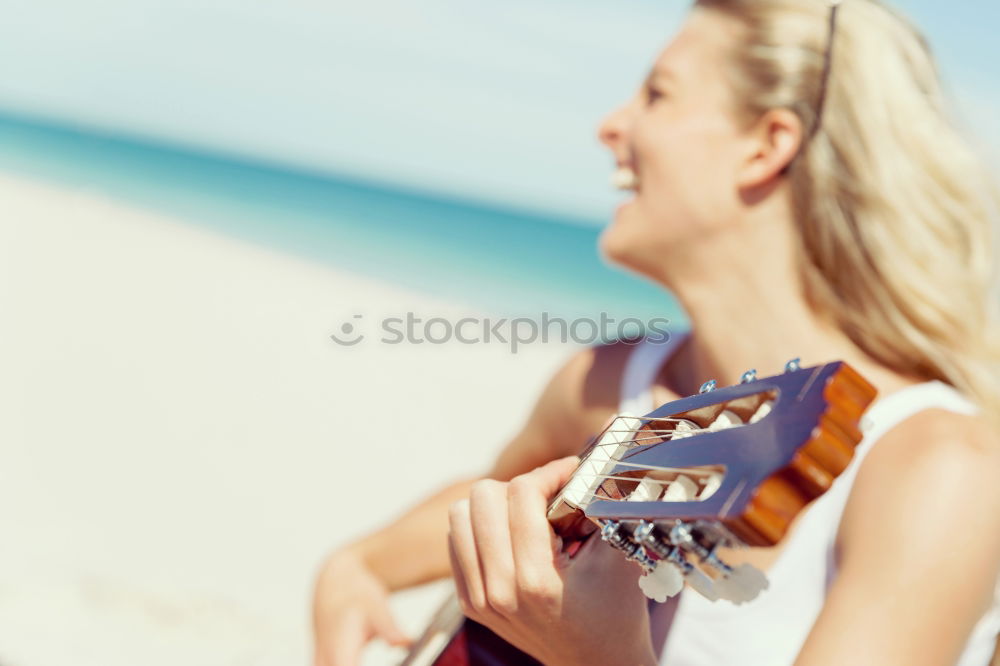 Similar – Beautiful woman playing guitar.