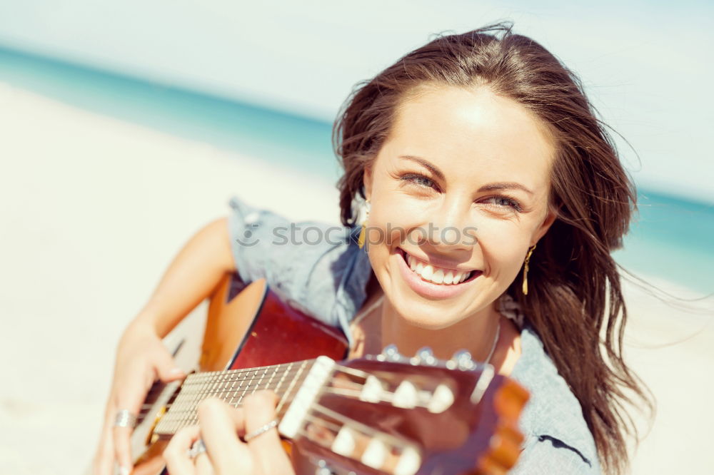 Similar – Beautiful woman playing guitar.