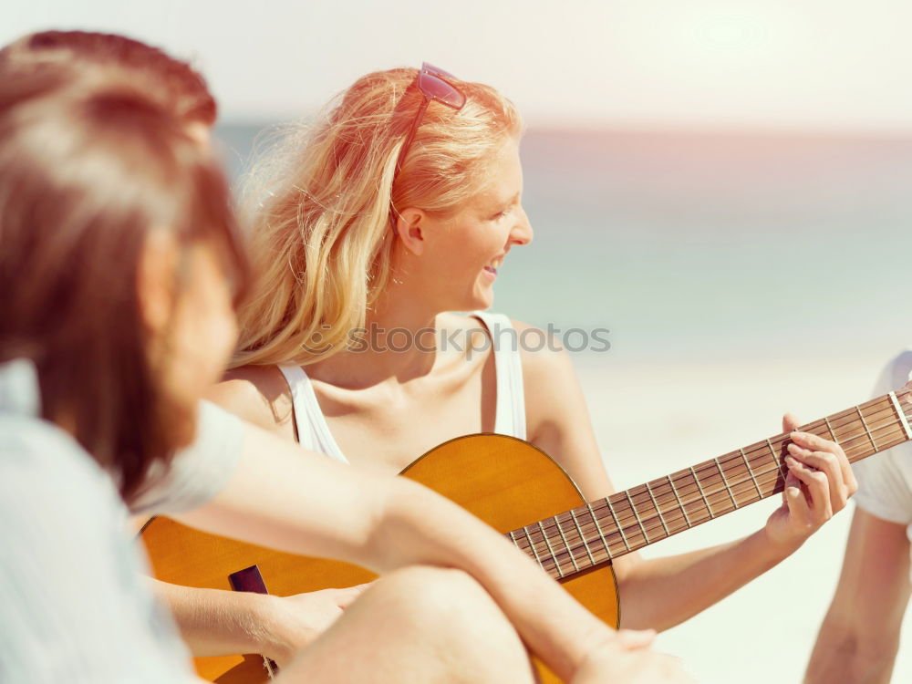 Similar – Beautiful woman playing guitar.