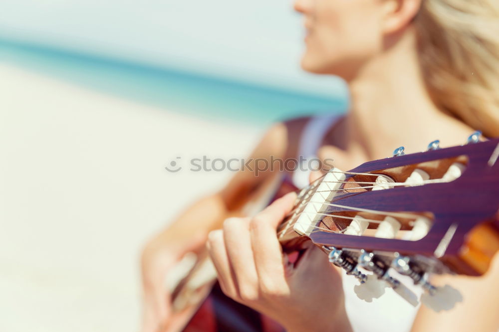 Similar – Beautiful woman playing guitar.