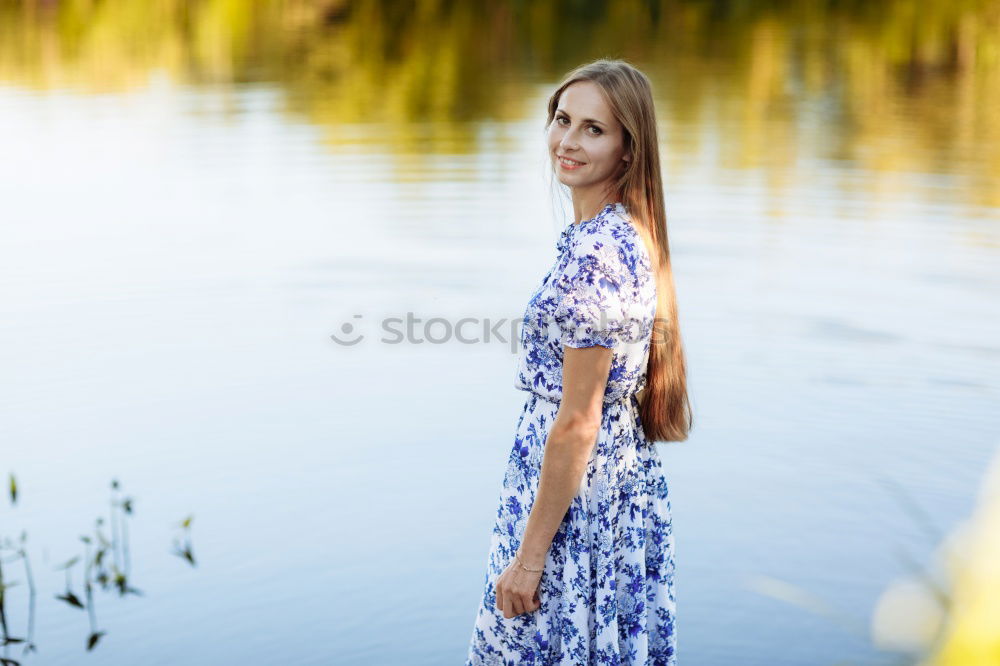 Young woman standing in the river Rhine