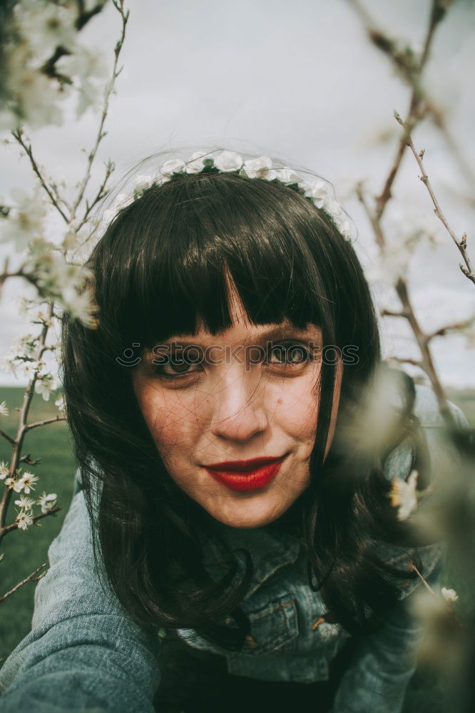 Similar – Portrait of a blue-eyed hiker looking at camera in the forest