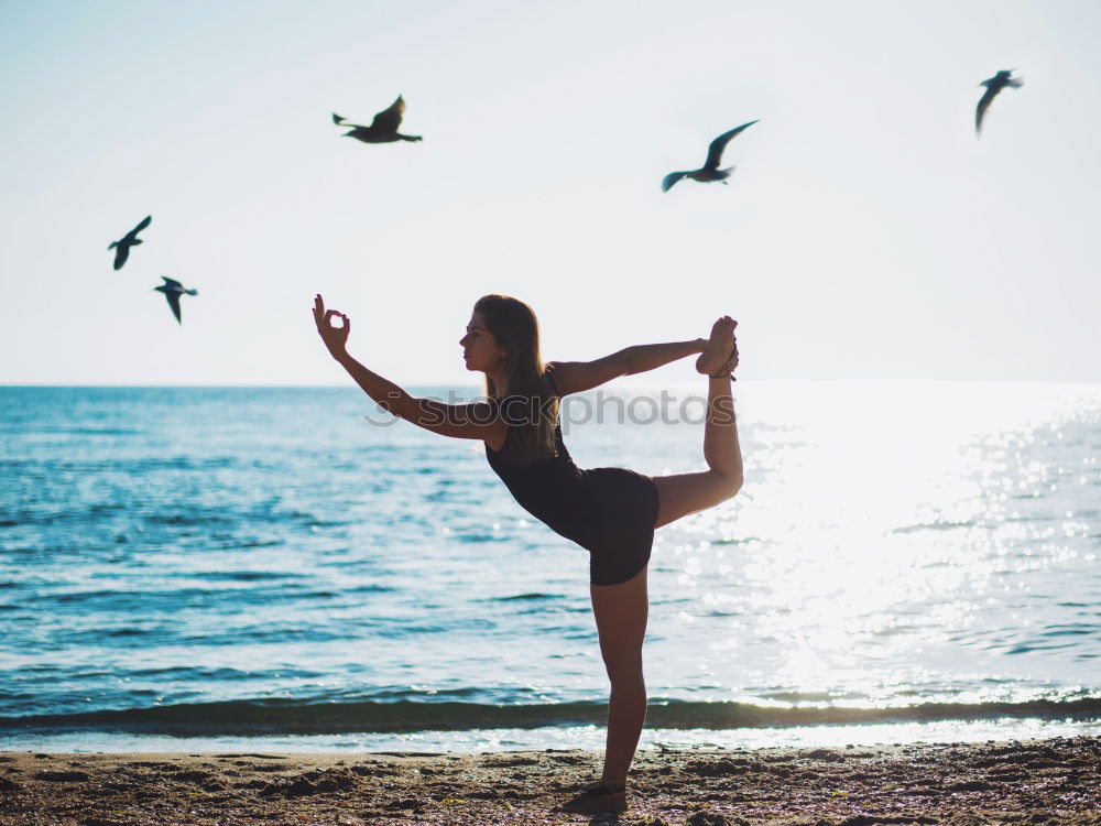 Similar – Caucasian blonde woman practicing yoga in the beach