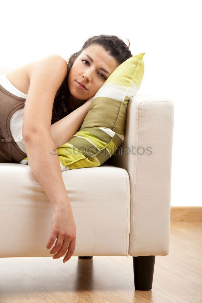 Similar – young tall woman sits on a light couch