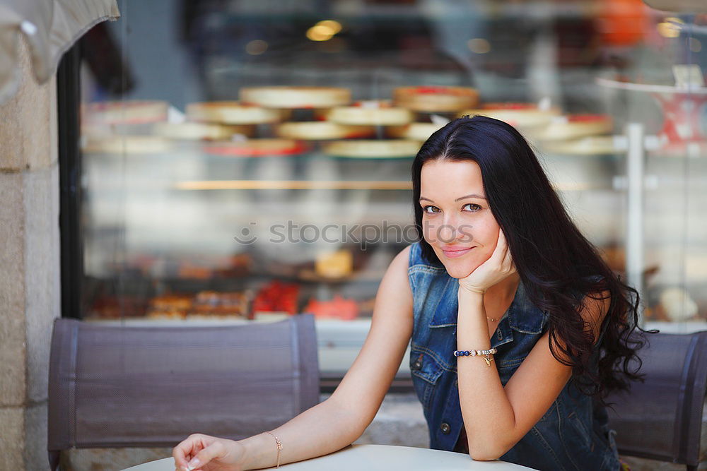 Similar – Image, Stock Photo Young woman smiling and sitting in an urban bar