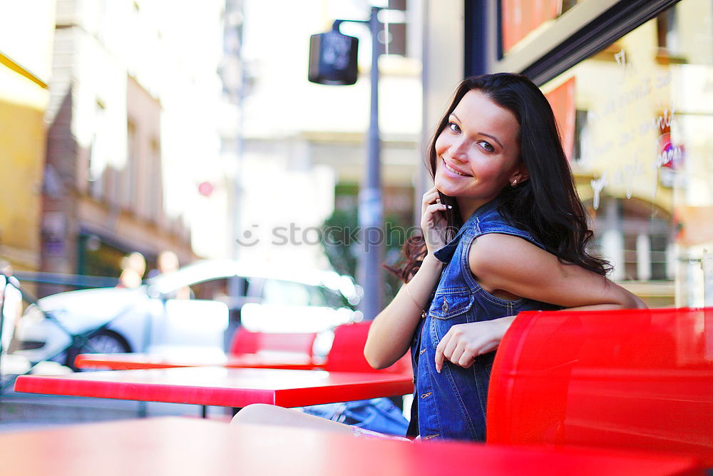 Similar – Beautiful Smiling Woman in red coat with mobile phone in hands, smartphone, urban scene