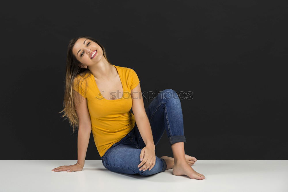 Similar – Woman sitting with one leg on chair