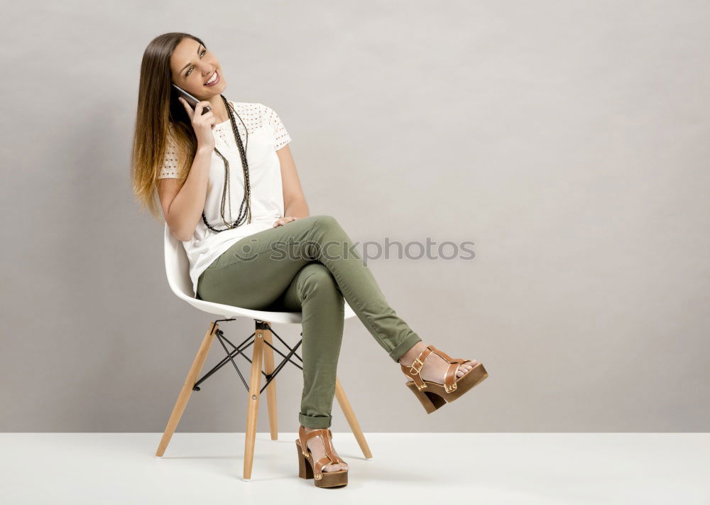 Similar – Image, Stock Photo Smiling young woman relaxing on sidewalk