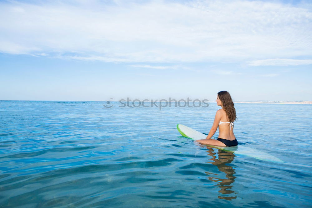 Similar – Image, Stock Photo Man in wetsuit swimming in ocean