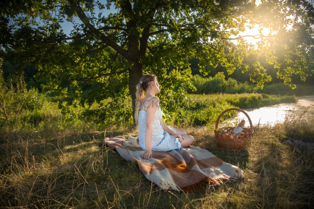 Similar – Beautiful little girl and her dog playing at sunset together