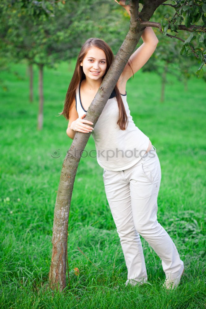 Similar – Summer portrait of long haired teen girl with short jeans shorts and belly top in park