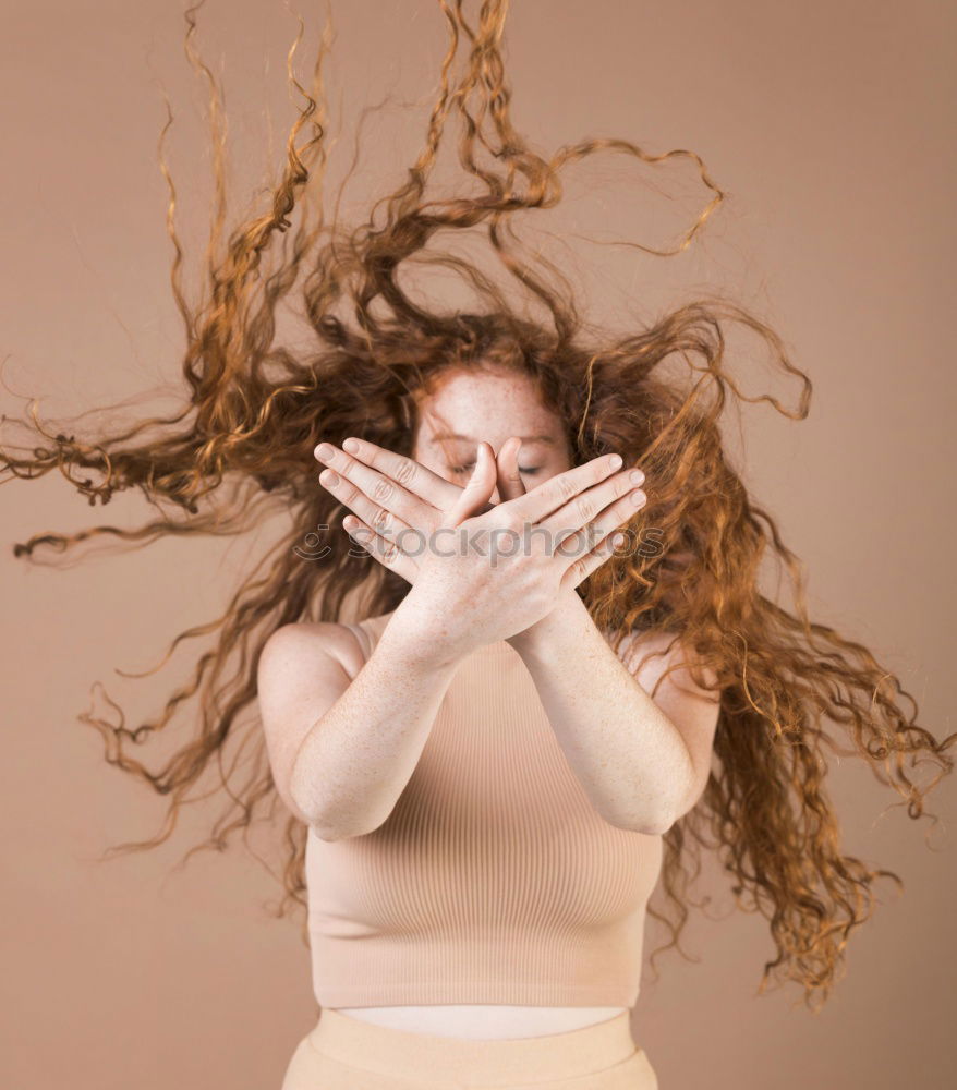 Similar – Frau im Wind mit den Haaren im Gesicht