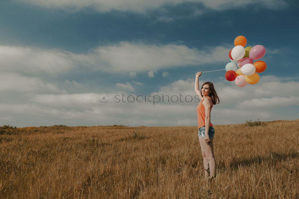 Similar – Woman in middle of wheat field