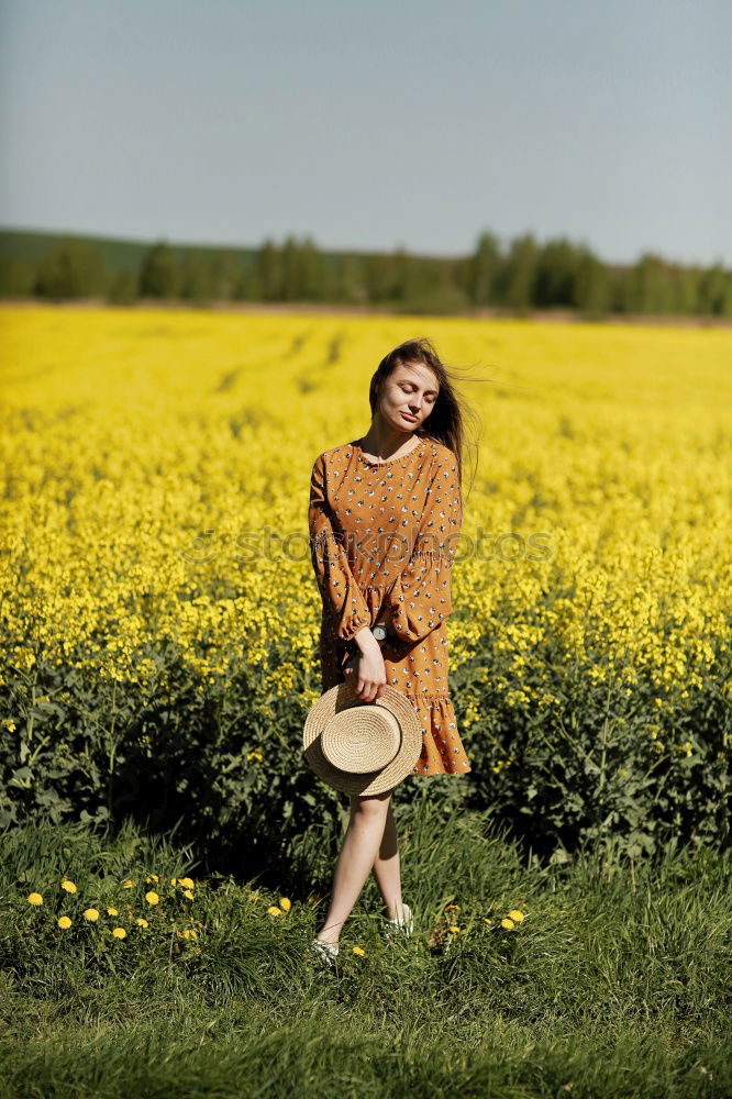 Similar – Image, Stock Photo analogue medium format portrait of a young woman sitting barefoot in a summer dress on a field in the heath