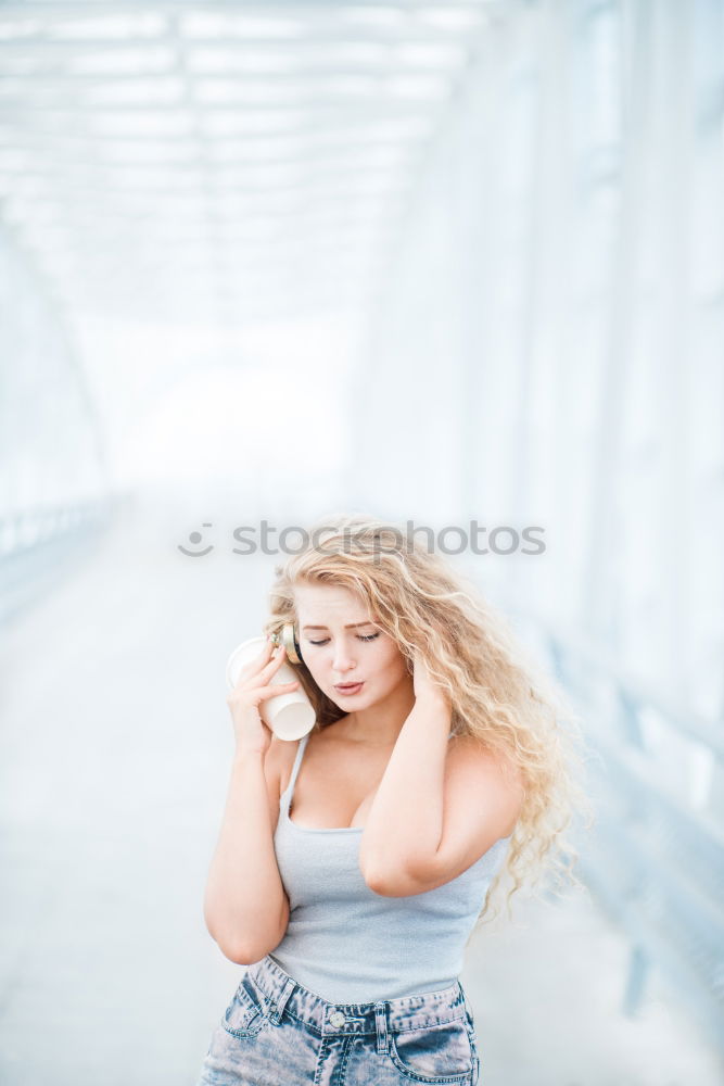 Similar – Young woman smiling in urban background.