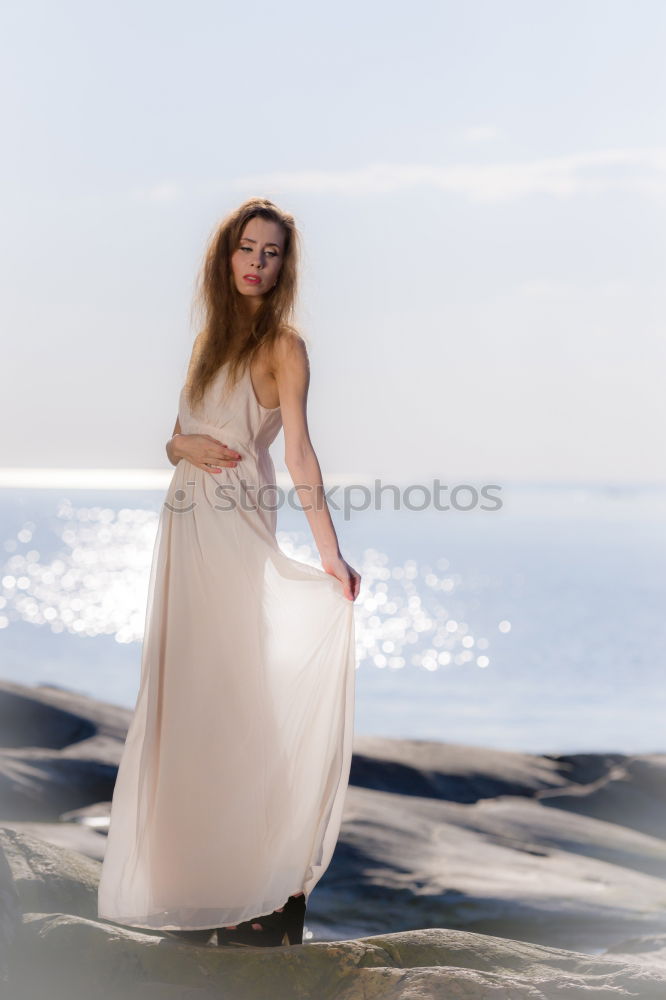 Similar – Woman with sunglasses plays with water