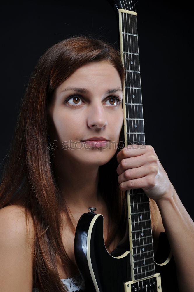 Similar – Image, Stock Photo Vibration | Guitar Pages II Young Woman Playing Guitar