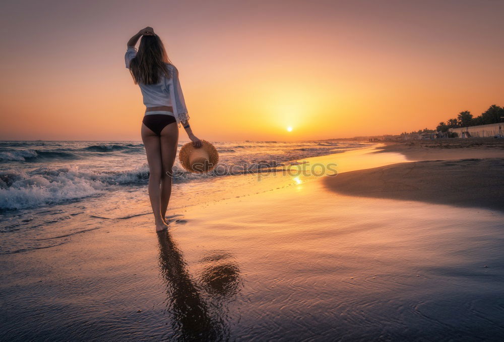 Similar – One happy little boy playing on the beach at the sunset time. Kid having fun outdoors. Concept of summer vacation.