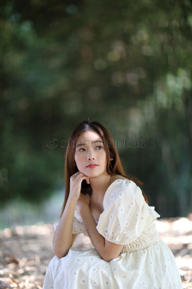 Similar – Image, Stock Photo Young, very athletic woman in skirt and t-shirt sits barefoot on a wooden bench in the forest with her legs crossed