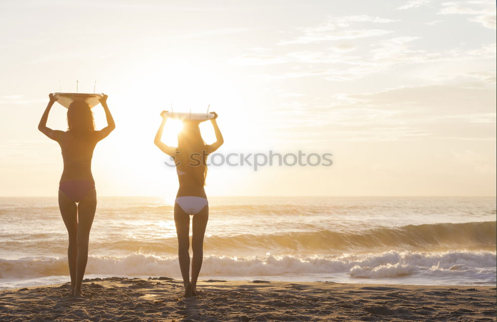 Similar – Image, Stock Photo Women with arms raised standing on the cliff