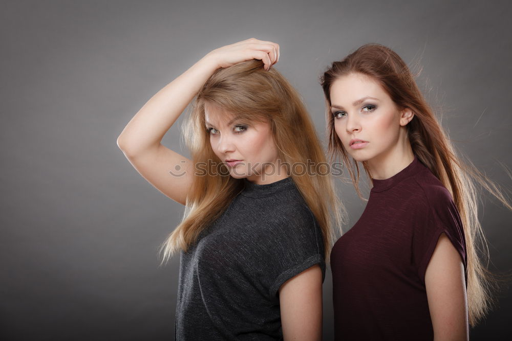 Similar – Two women embracing in studio