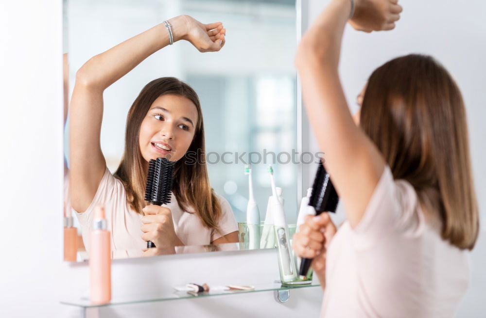 Similar – Young female adult brushing teeth in the morning