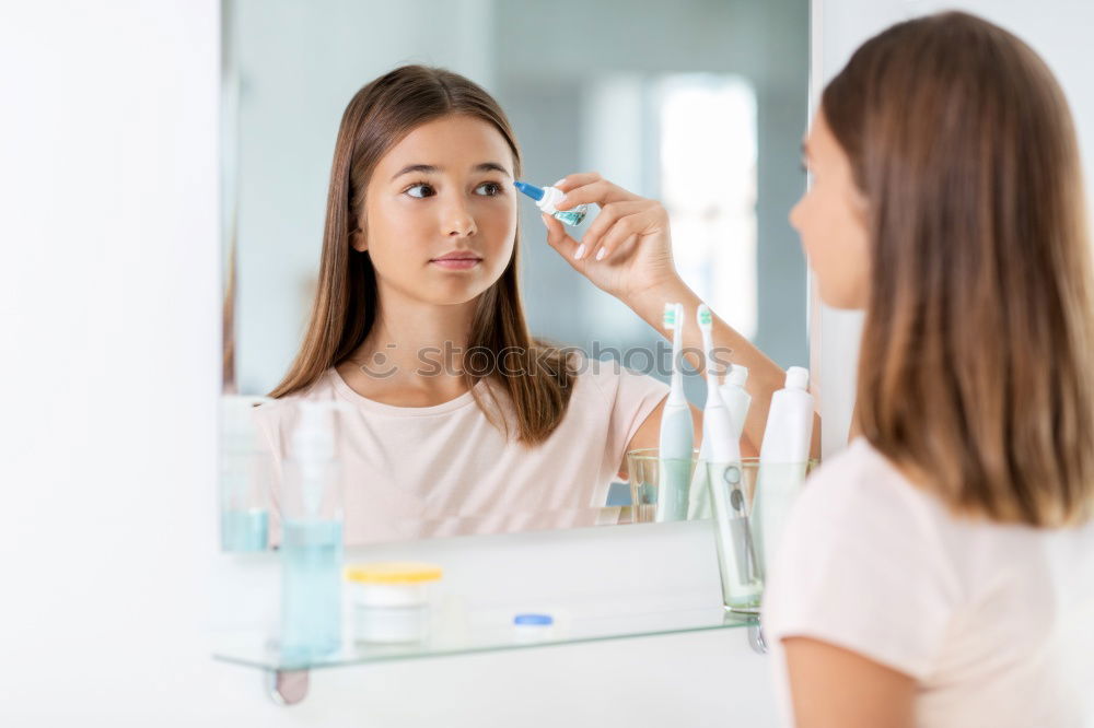 Similar – Young female adult brushing teeth in the morning