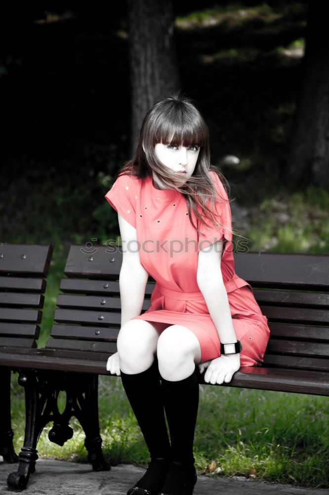 Similar – A young woman sitting on a garden bench