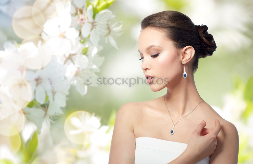 Similar – Young woman smelling almond flowers in springtime