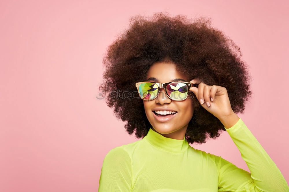 Similar – Image, Stock Photo Young beautiful Afro-American woman posing and smiling while standing against brick wall